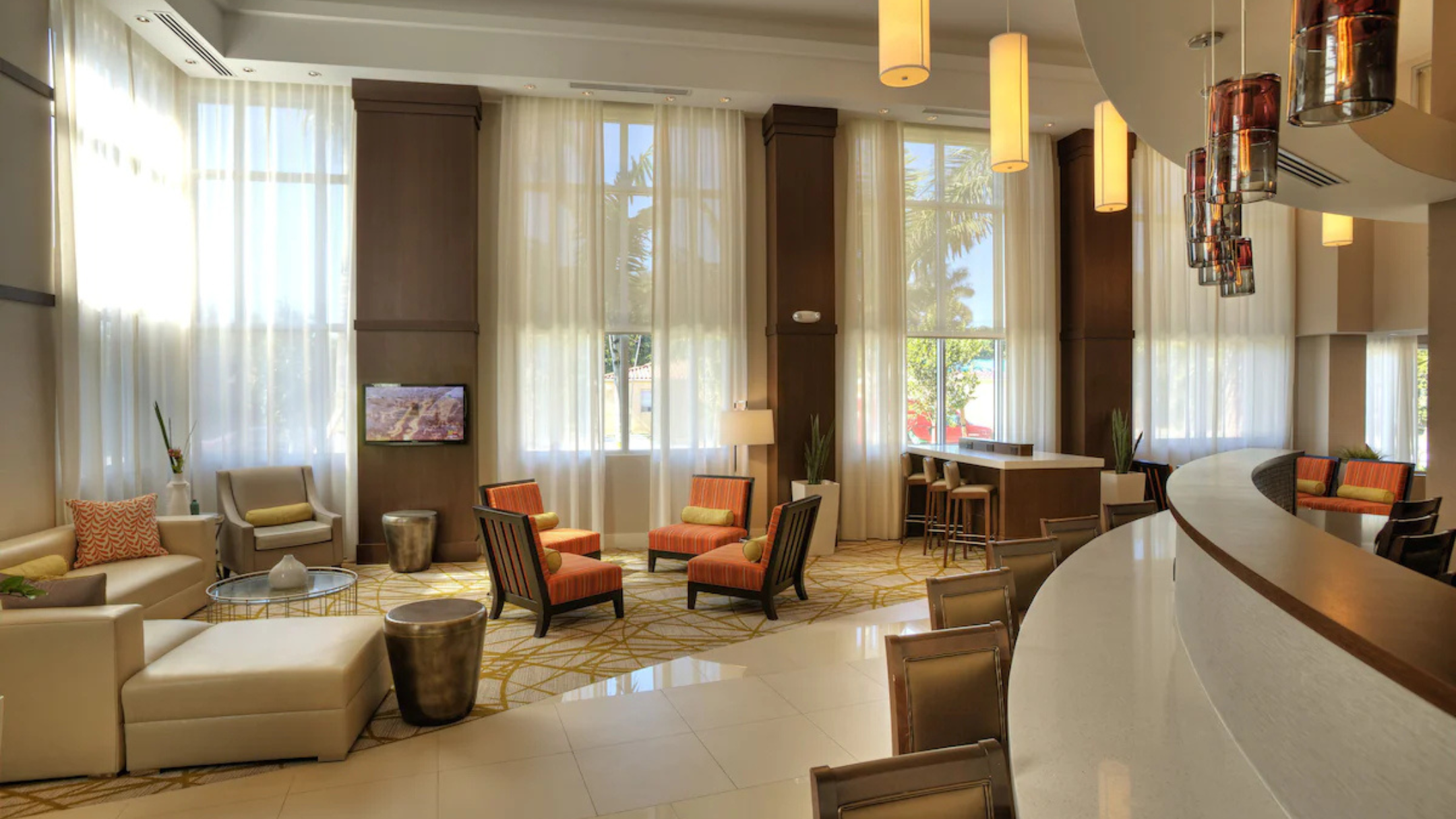 Comfort Suites Miami Airport North lobby with seating area